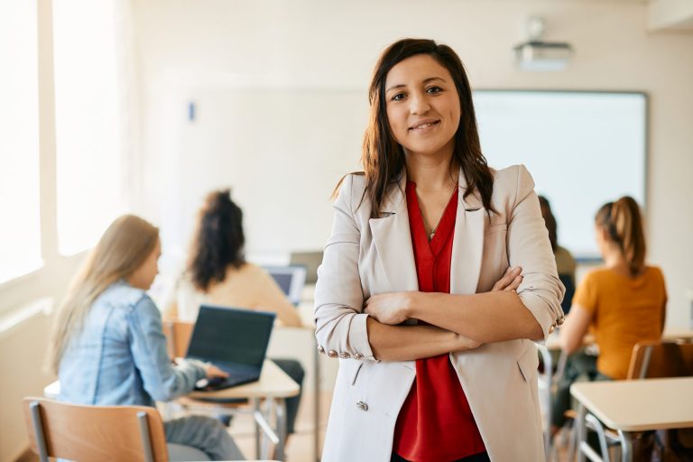 Teacher with graduate students in background